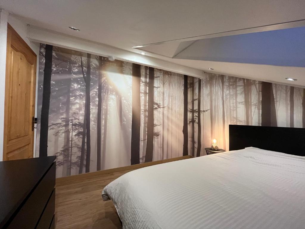 Postel nebo postele na pokoji v ubytování Chalet Mésange