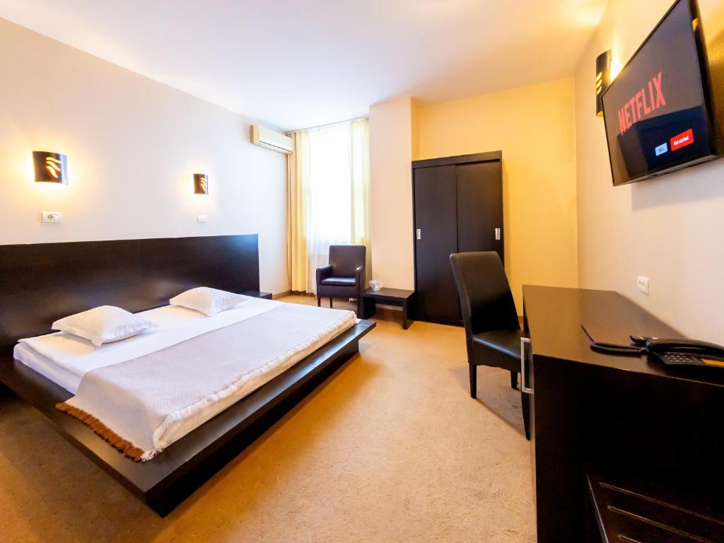 TV a/nebo společenská místnost v ubytování Hotel Maxim
