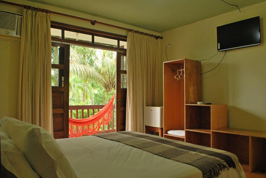 Katil atau katil-katil dalam bilik di Paraíso das Águas Hotel Bahia