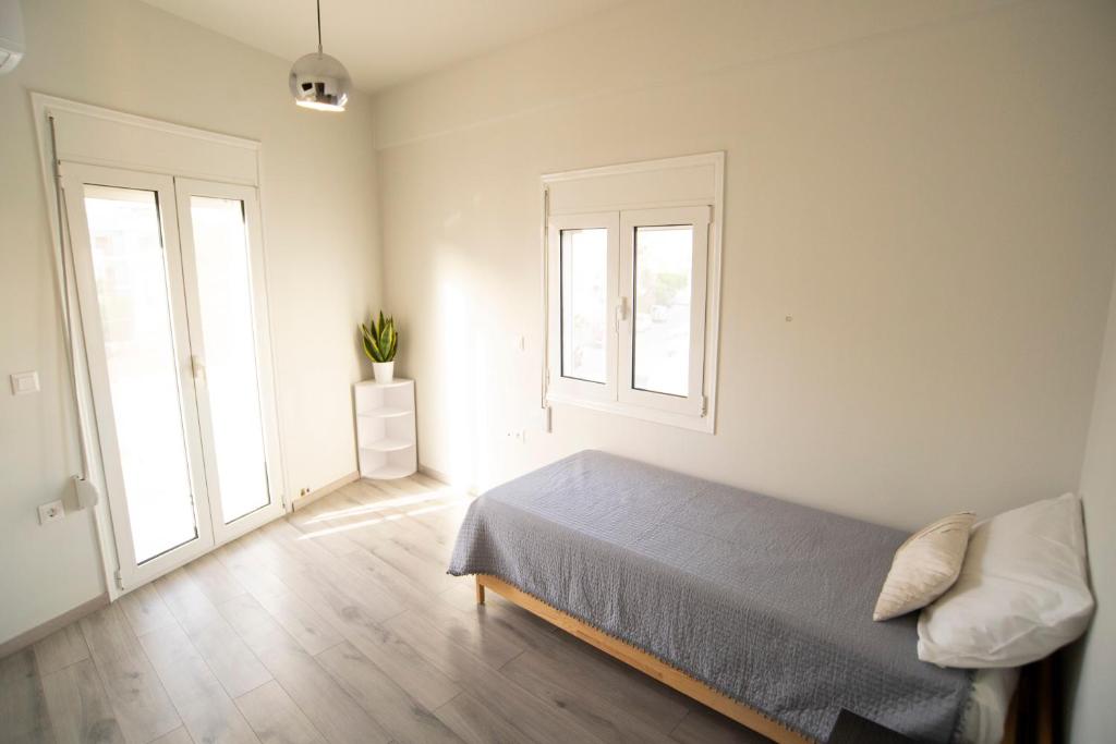 Posteľ alebo postele v izbe v ubytovaní Ierapetra flats 2