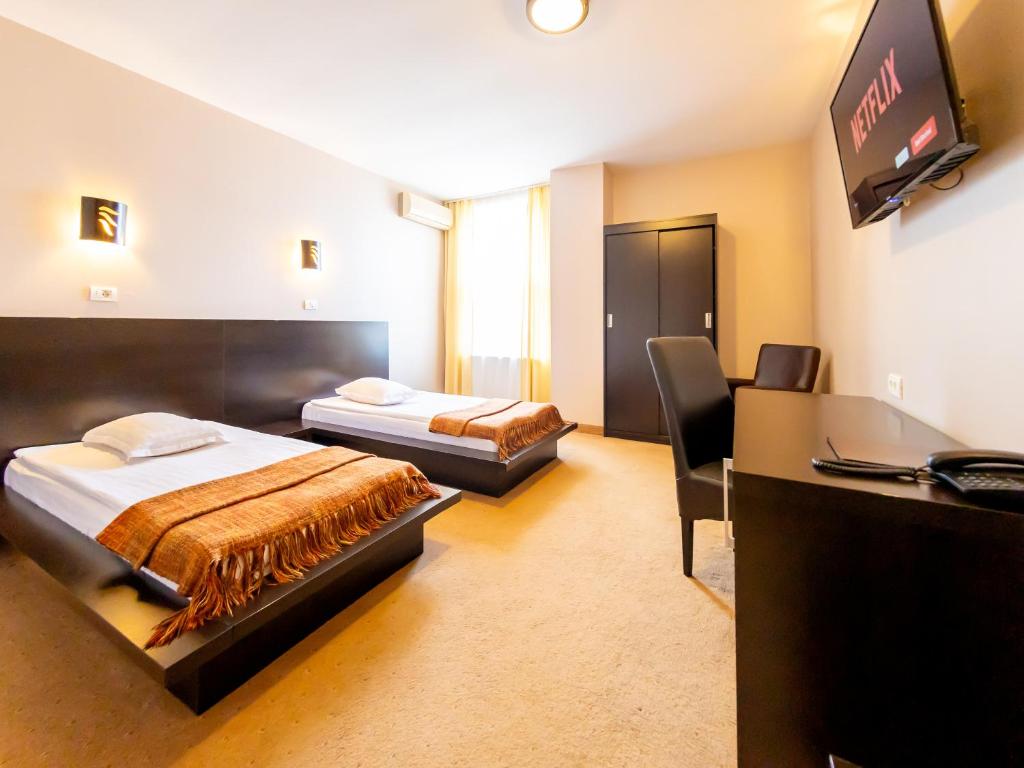 Hotel Maxim - Chambre Jumelée