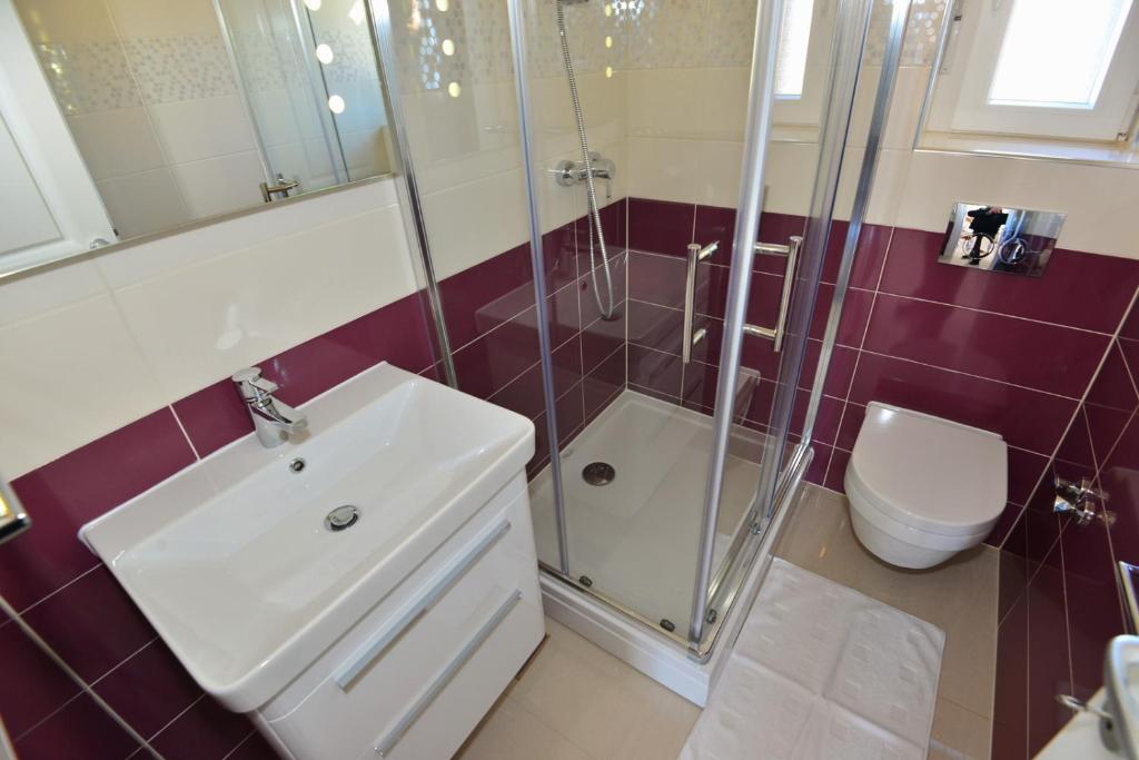 Kúpeľňa v ubytovaní Apartments Villa Coratina