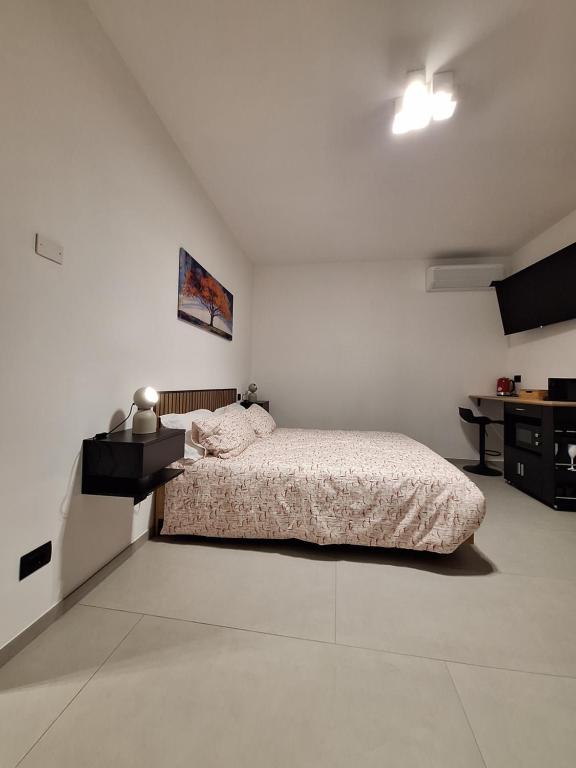 Postel nebo postele na pokoji v ubytování The One Malpensa Rooms