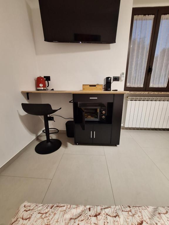 TV a/nebo společenská místnost v ubytování The One Malpensa Rooms