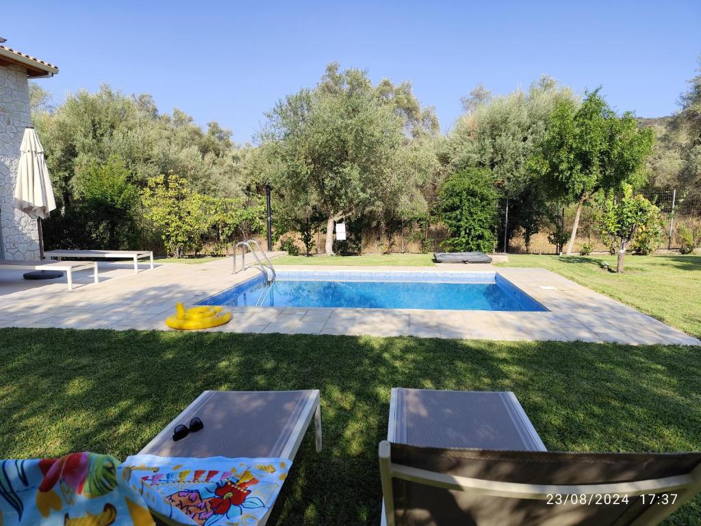 The swimming pool at or close to Alexandros Stone House