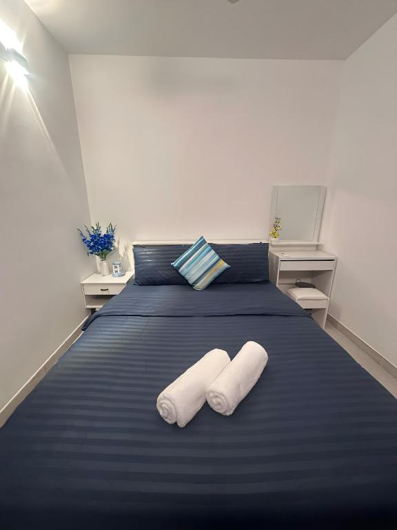 Postel nebo postele na pokoji v ubytování Lilys Homestay By Dhalhey's