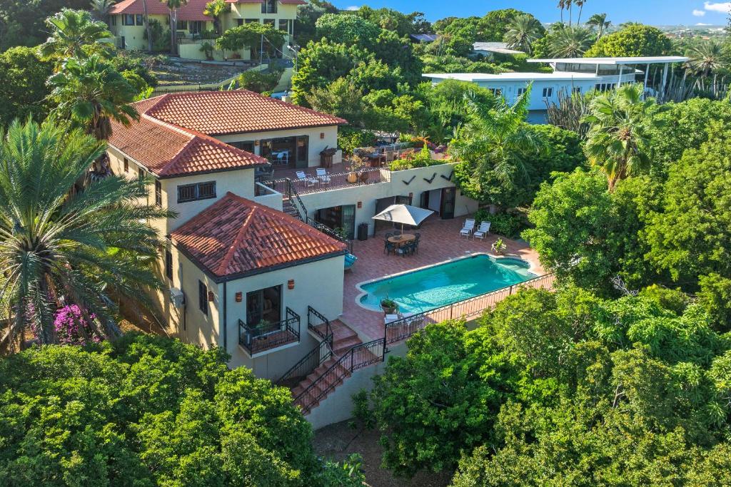 an aerial view of a house with a swimming pool at Villa Casablanca in Willemstad