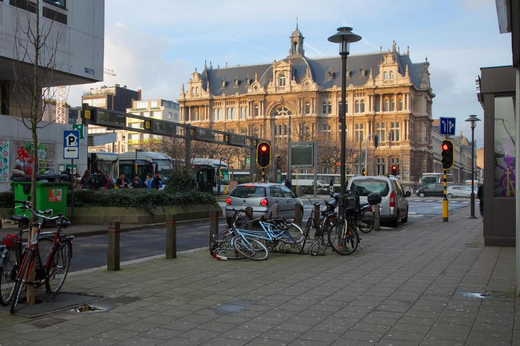 a group of bikes parked on a street with a traffic light at ATW Apartments in Antwerp