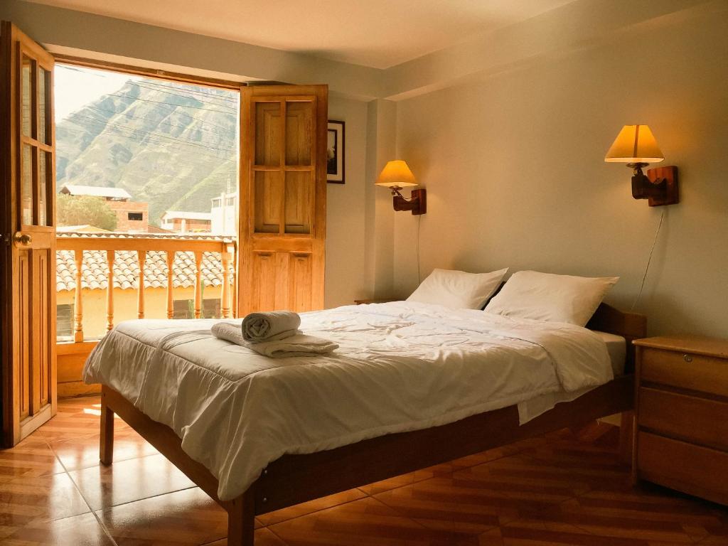 Postel nebo postele na pokoji v ubytování Nafis Casona Apu Linli Pisac