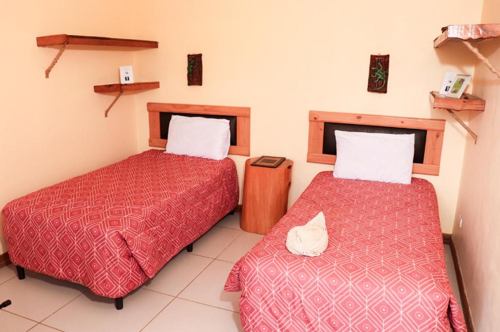 Postel nebo postele na pokoji v ubytování Hotel Orocay Lodge