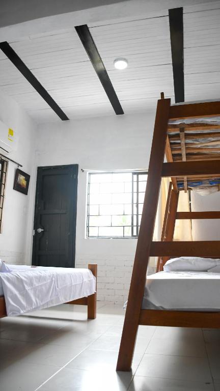 Postel nebo postele na pokoji v ubytování Cabaña la Arenosa