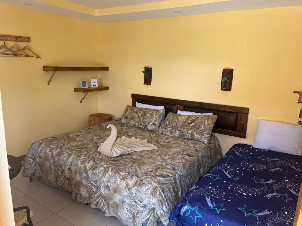 Postel nebo postele na pokoji v ubytování Hotel Orocay Lodge