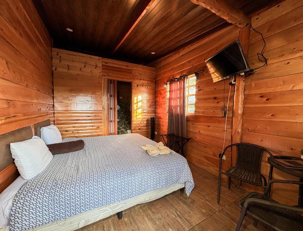 Postel nebo postele na pokoji v ubytování Hotel Orocay Lodge