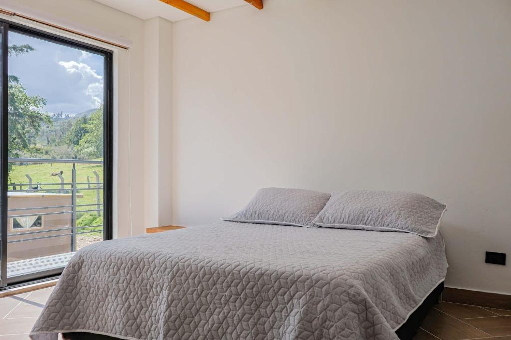 Postel nebo postele na pokoji v ubytování Granja Ecoturística Encuentros