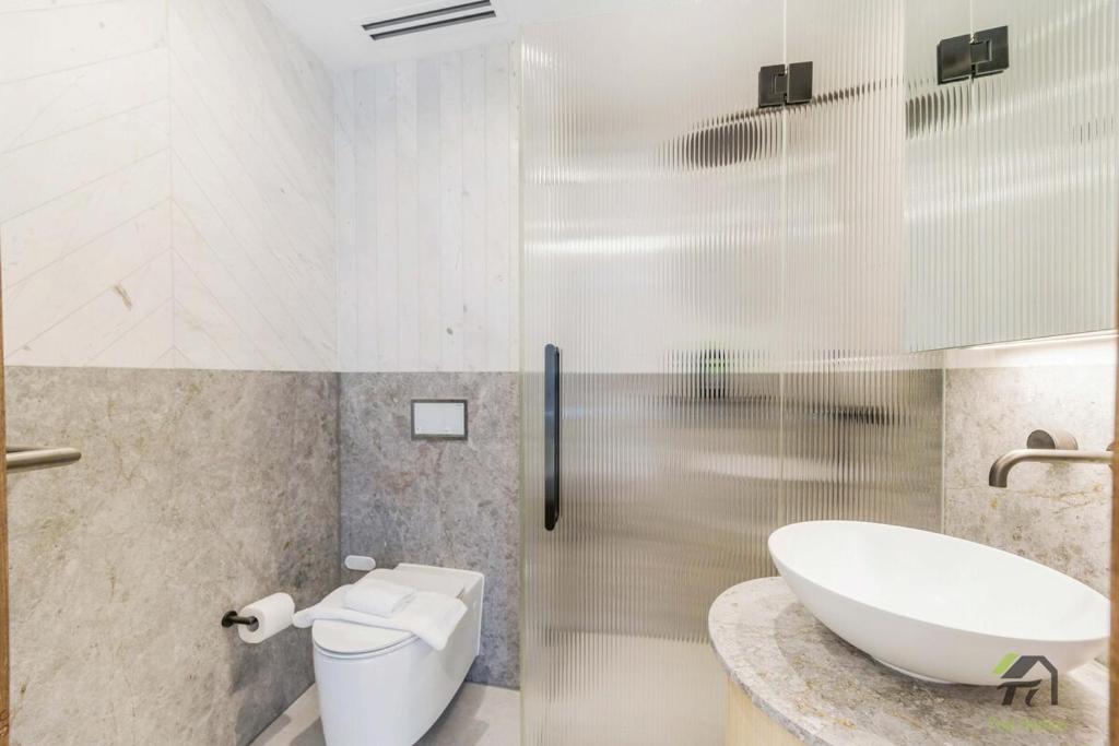 a bathroom with a sink and a toilet and a tub at Harbour view new year firework in Sydney