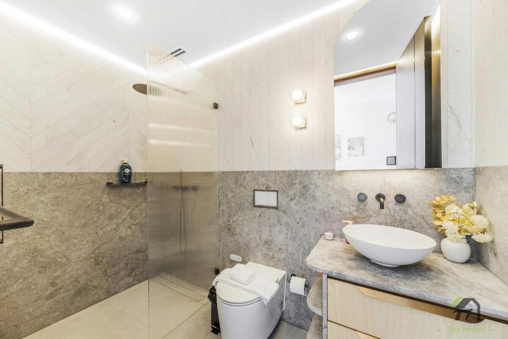 a bathroom with a toilet and a sink at Harbour view new year firework in Sydney