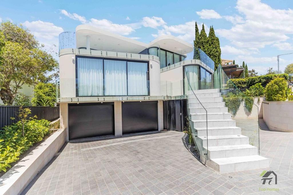 a house with a staircase in front of it at Harbour view new year firework in Sydney