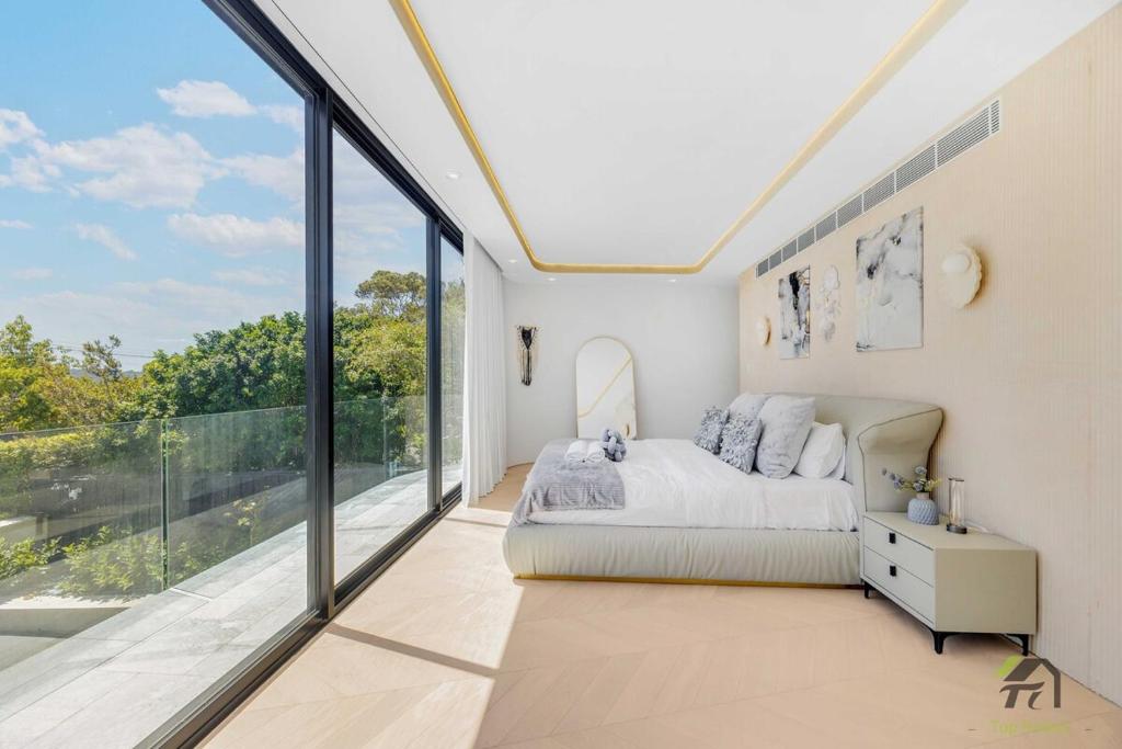 a bedroom with a bed and a large window at Harbour view new year firework in Sydney