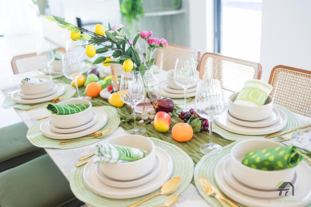 a table with plates and bowls of fruit on it at Harbour view new year firework in Sydney