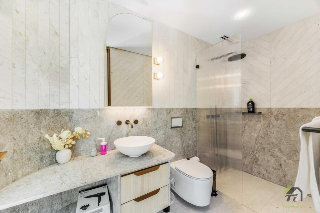 a bathroom with a sink and a toilet at Harbour view new year firework in Sydney