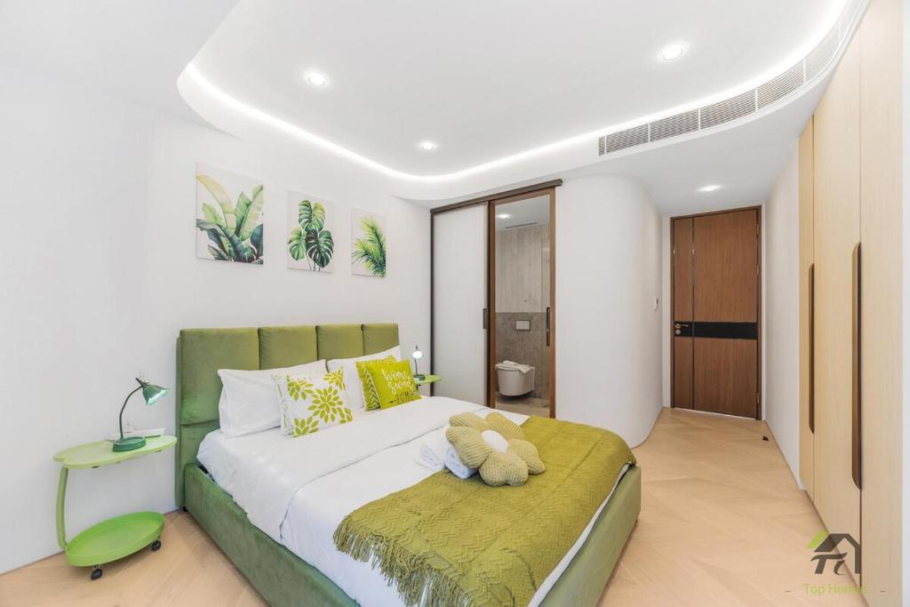 a teddy bear sitting on a bed in a bedroom at Harbour view new year firework in Sydney