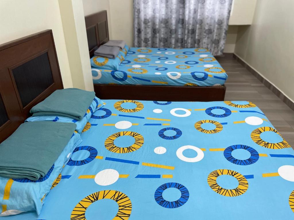 Postel nebo postele na pokoji v ubytování KB Guesthouse