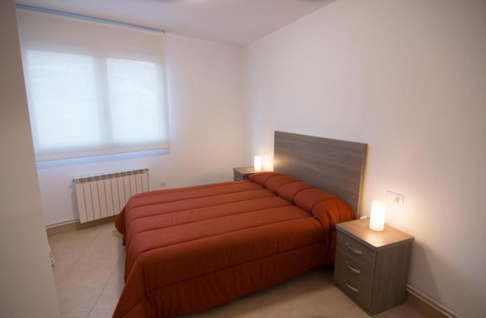 Posteľ alebo postele v izbe v ubytovaní Apartament Bagà