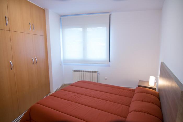 Posteľ alebo postele v izbe v ubytovaní Apartament Bagà