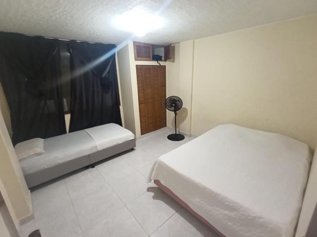 Ένα ή περισσότερα κρεβάτια σε δωμάτιο στο habitación