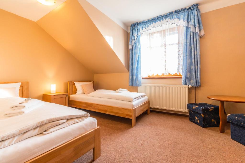 Postel nebo postele na pokoji v ubytování Hotel Franz