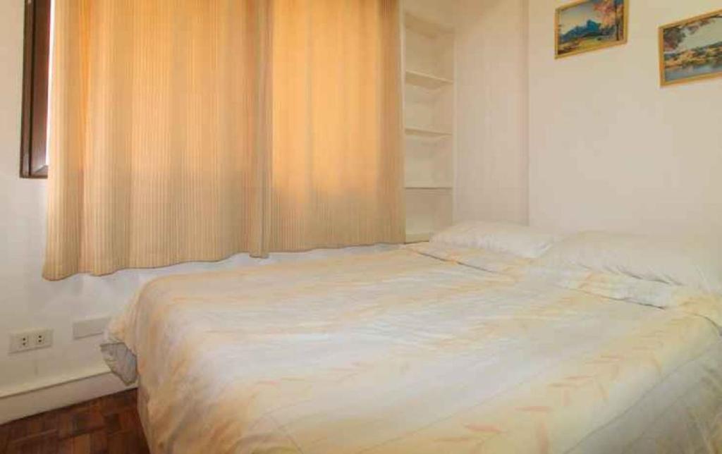 Postel nebo postele na pokoji v ubytování Sunette Tower Makati