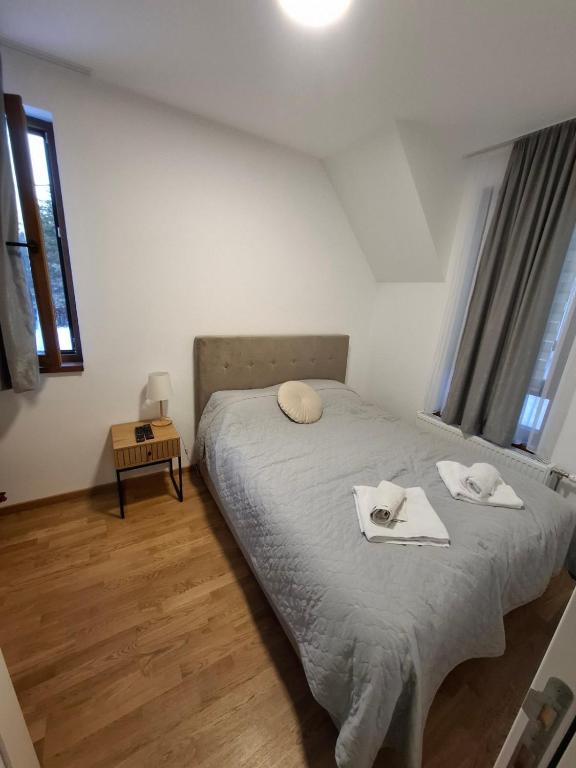 Postel nebo postele na pokoji v ubytování Apartman Nina Divcinova