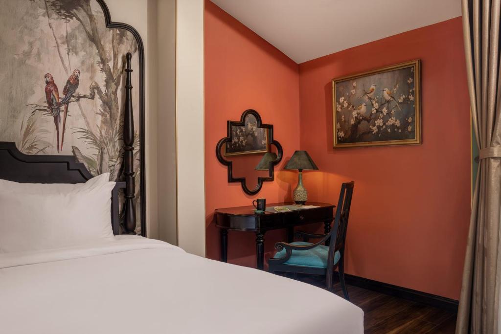 Postel nebo postele na pokoji v ubytování The An Bang Vanessa - Indochine Boutique Hotel