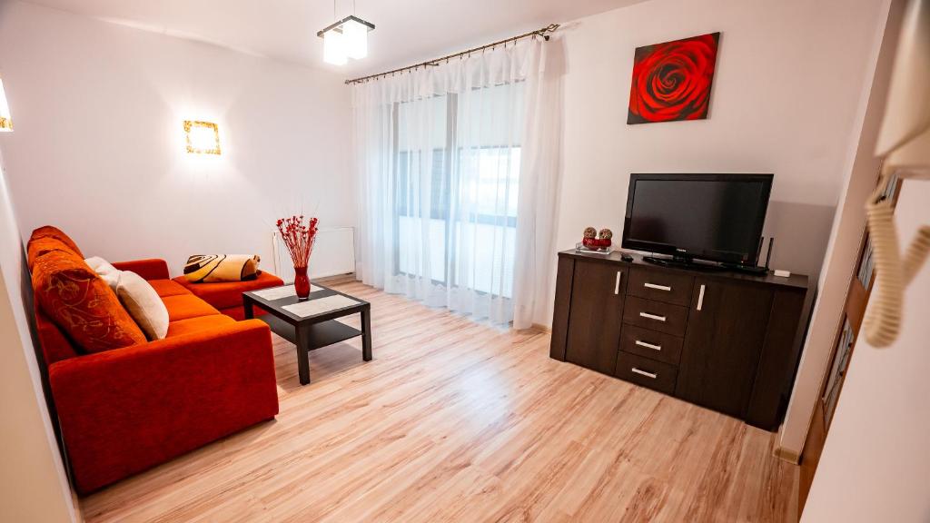 Televízia a/alebo spoločenská miestnosť v ubytovaní Apartamenty Sun & Snow Kraszewskiego