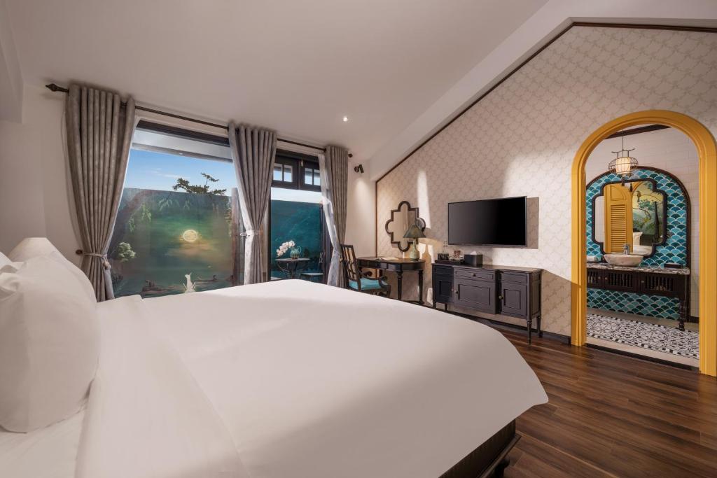 TV a/nebo společenská místnost v ubytování The An Bang Vanessa - Indochine Boutique Hotel