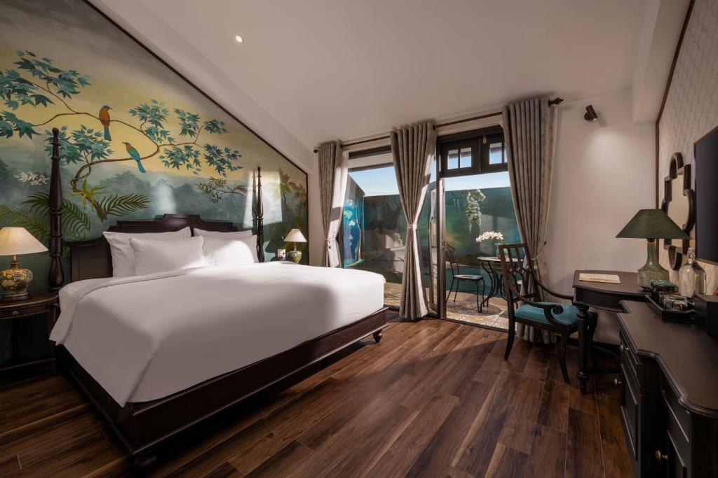 Giường trong phòng chung tại The An Bang Vanessa - Indochine Boutique Hotel