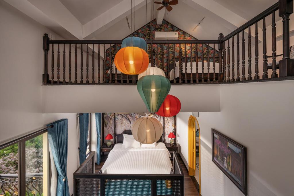 Giường trong phòng chung tại The An Bang Vanessa - Indochine Boutique Hotel