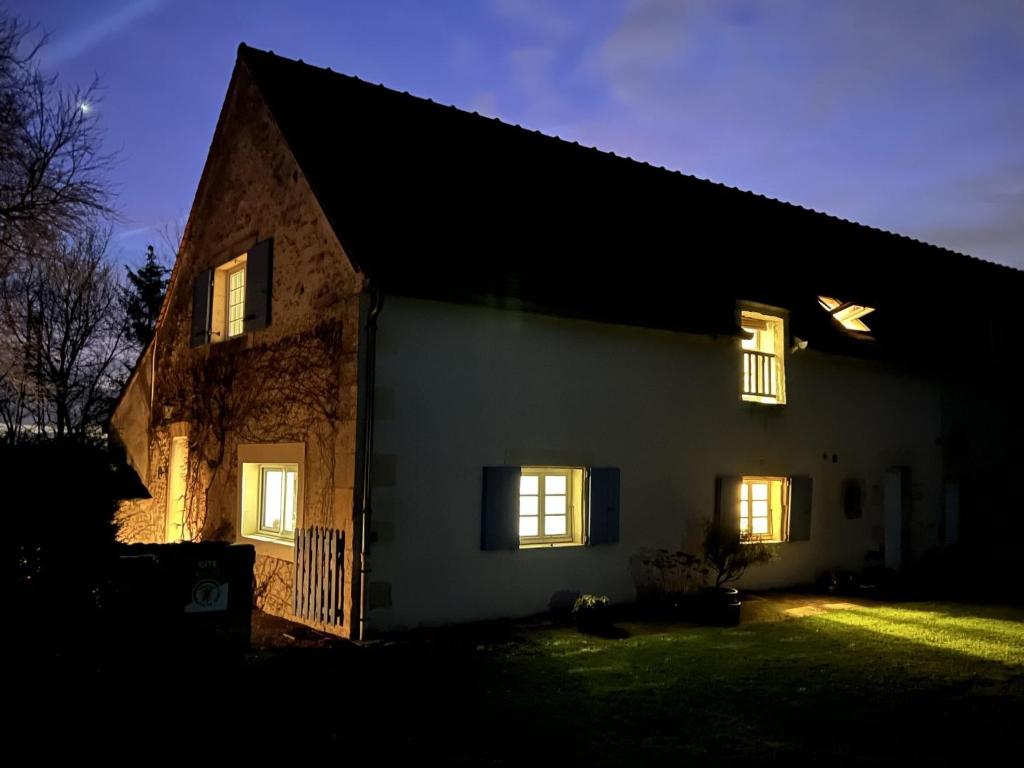 a house at night with its lights on at Gites de Gondières in Saint-Éloi