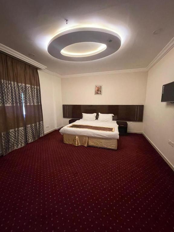 Postel nebo postele na pokoji v ubytování فندق اوتاد المتحدة عبالله الخياط
