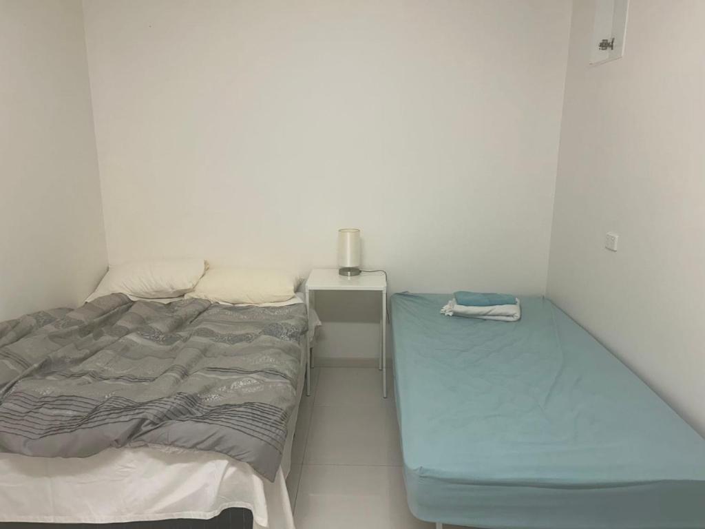Postel nebo postele na pokoji v ubytování Dynamic Edge