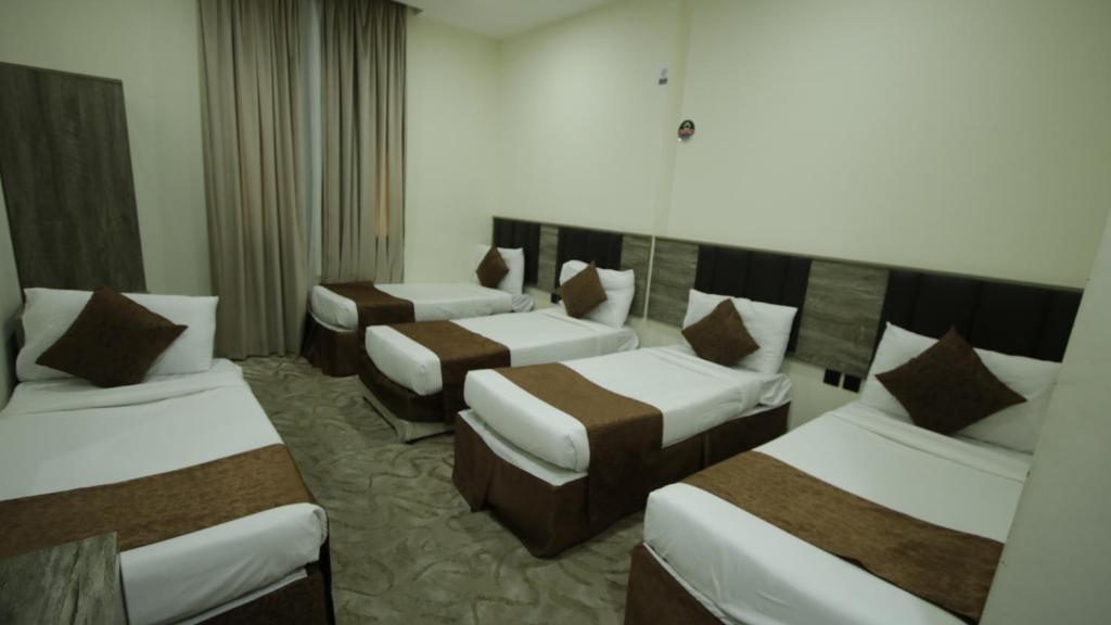 Postel nebo postele na pokoji v ubytování Mila HOTEL MAKKAH