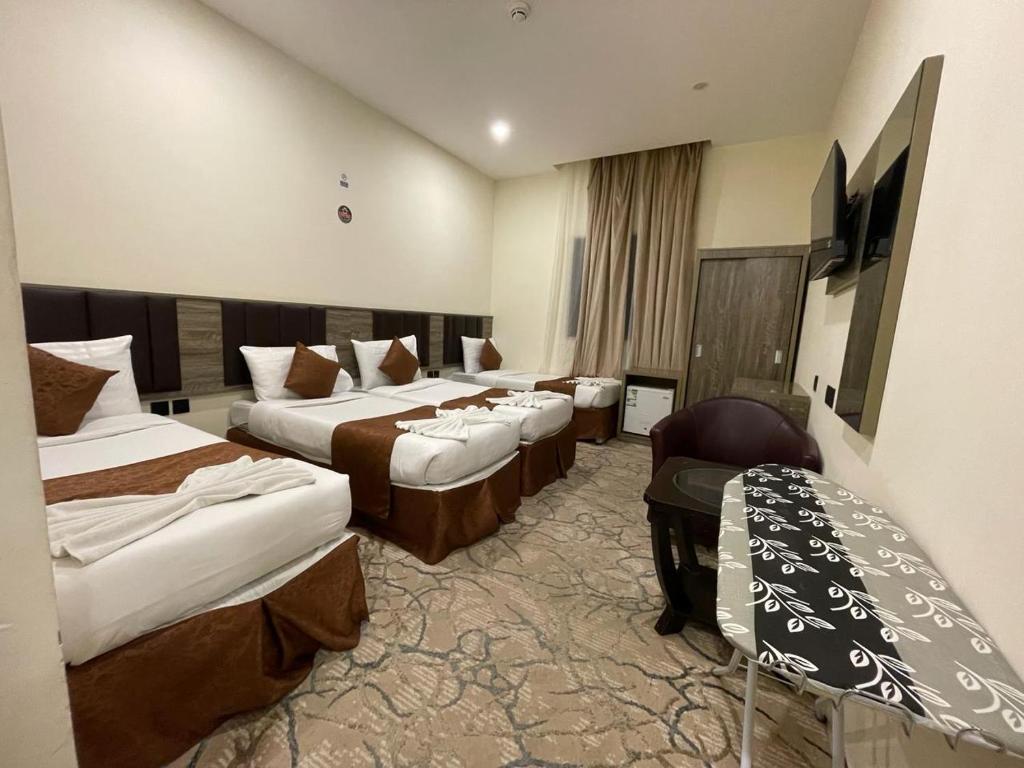 Postel nebo postele na pokoji v ubytování Mila HOTEL MAKKAH