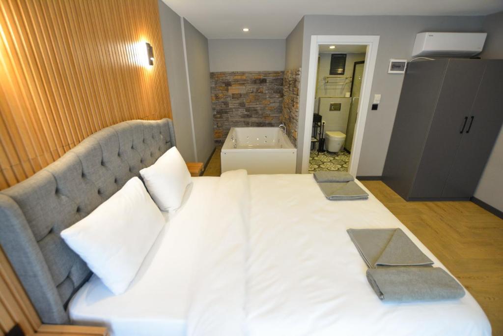 Postel nebo postele na pokoji v ubytování Ağva Casa Rosa Bungalov Otel