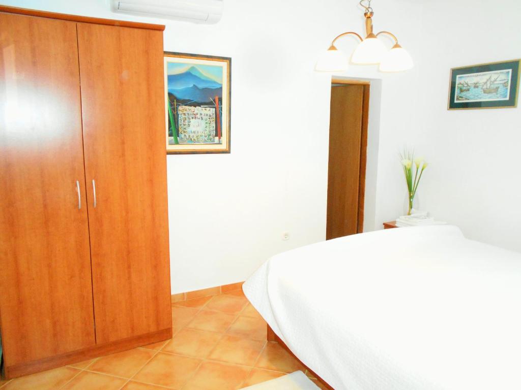 Łóżko lub łóżka w pokoju w obiekcie Apartments Doda