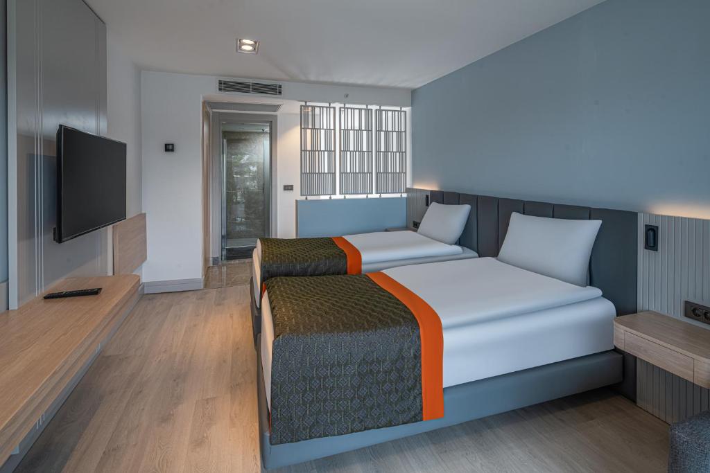 Postel nebo postele na pokoji v ubytování Swandor Hotels & Resorts - Kemer