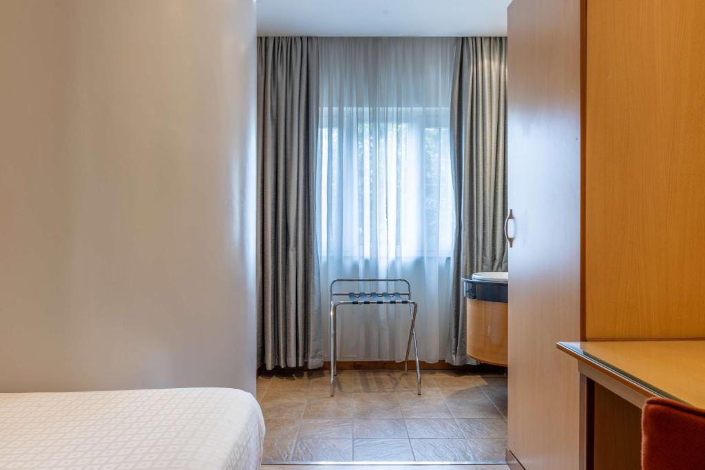 Postel nebo postele na pokoji v ubytování Best Western Nairobi Upper Hill