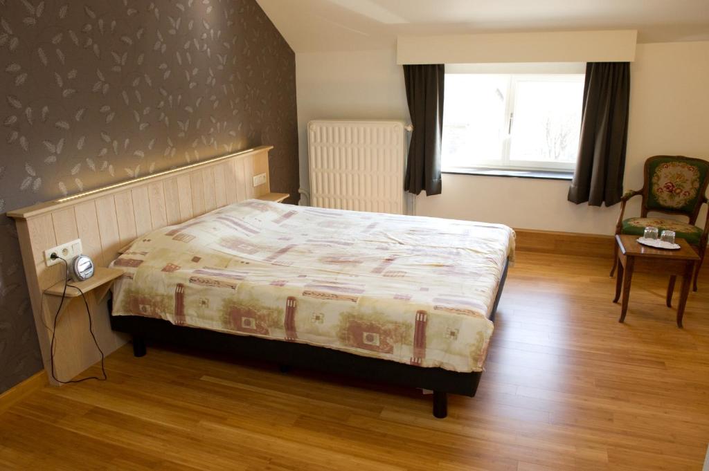 Postel nebo postele na pokoji v ubytování Auberge Saint-Martin