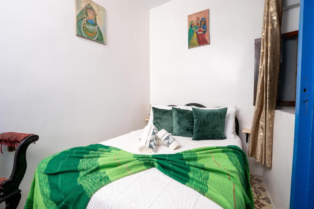 A bed or beds in a room at Dar AL GHAZAL