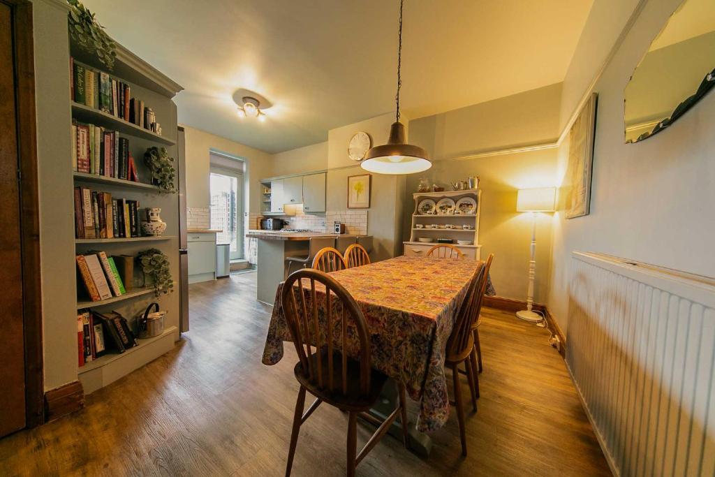 a kitchen and dining room with a table and chairs at 107a - 3 Double Bedrooms in Lytham St Annes