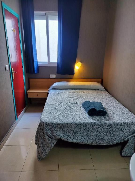 Postel nebo postele na pokoji v ubytování Sant Jordi Cami de Ronda